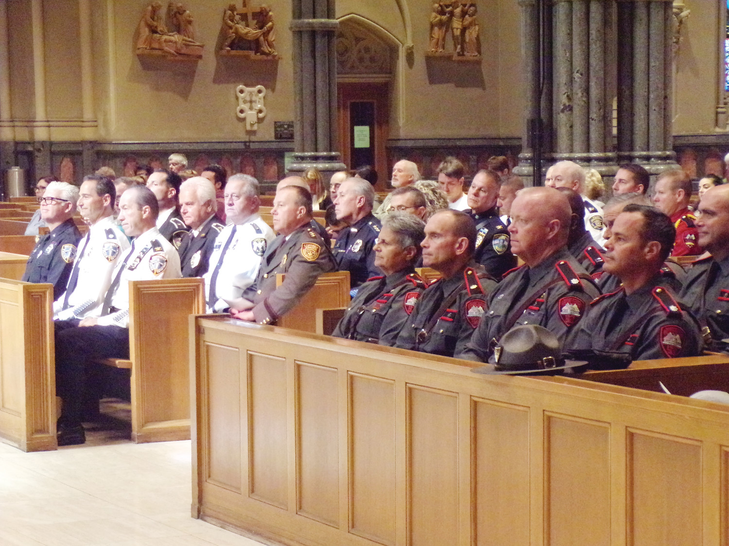 GATHERED TOGETHER IN PRAYER: Many took part in the Mass for Public Safety which honored police, fire and first responders and served as an opportunity to pray for God’s protection in their work.